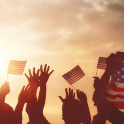 celebrating fourth of july - sunset - flag and hands in air Fourth of July - Mintz and Geftic Personal Injury Lawyer