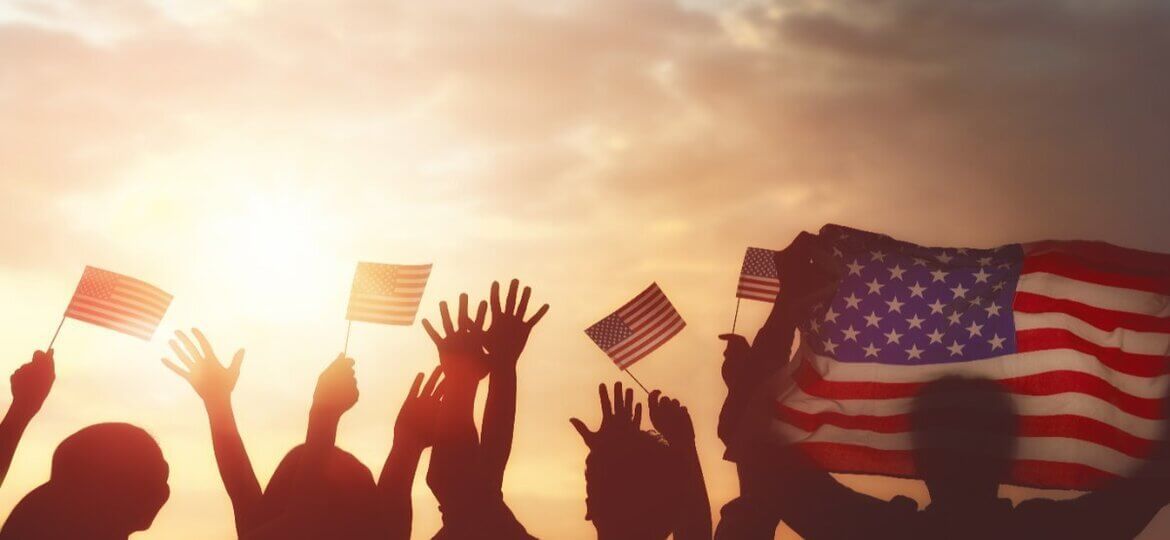 celebrating fourth of july - sunset - flag and hands in air Fourth of July - Mintz and Geftic Personal Injury Lawyer